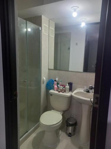 a bathroom with a toilet and a sink and a shower at Apto Torres de Montreal in Barranquilla