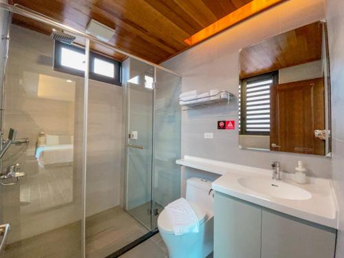 a bathroom with a shower and a sink at Zhaohong homestay in Yuchi