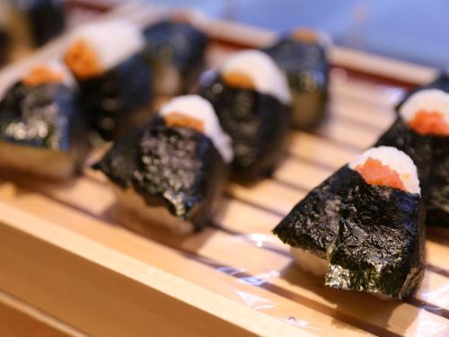a bunch of sushi sitting on a tray at Dormy Inn Ueno Okachimachi in Tokyo