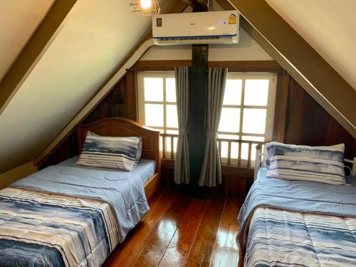 Postel nebo postele na pokoji v ubytování Kid & Aln Home Sweet Home