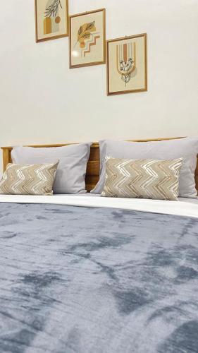 Ένα ή περισσότερα κρεβάτια σε δωμάτιο στο Juliana HomeStay