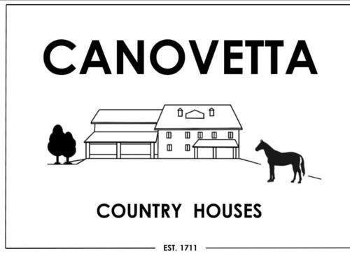 a black and white picture of a country house and a horse at Canovetta Country House "Camelia" - nearby Cremona in Dosimo