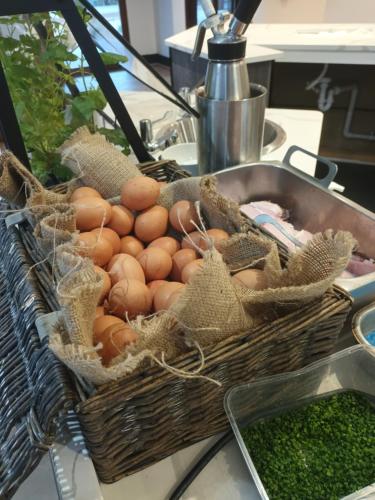 a basket of eggs on a counter next to a sink at CIM Business Centre in Maidenhead