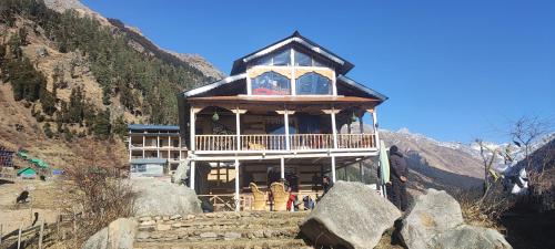 a large house on top of a mountain at Devropa Heights in Malāna