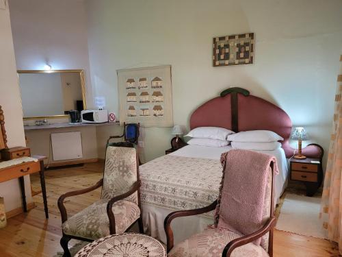 Katil atau katil-katil dalam bilik di Herb Garden Guesthouse