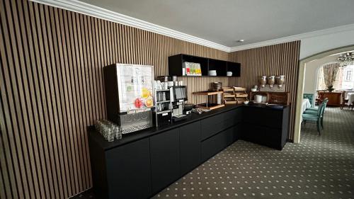 Η κουζίνα ή μικρή κουζίνα στο Boutique Hotel am Rathaus - Reblaus
