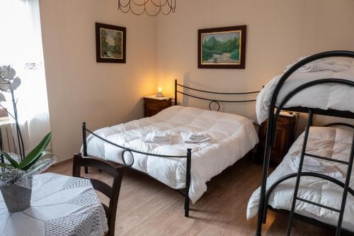 a bedroom with two bunk beds and a lamp at Masseria boutique b&b in Montella