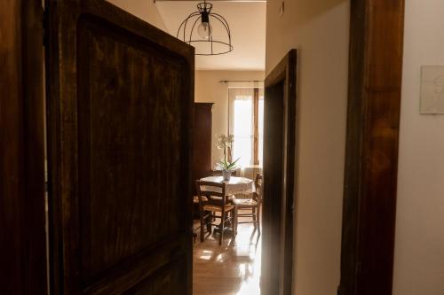 an open door to a dining room with a table at Masseria boutique b&b in Montella
