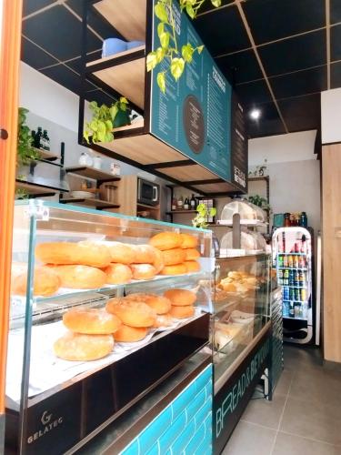 a bakery with a bunch of donuts on display at "Spirit of Malta" Historic Maltese Townhouse by the sea in Sliema