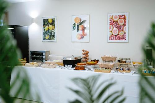 a table with a buffet of food on it at Hotel Premiere in Marina di Varcaturo