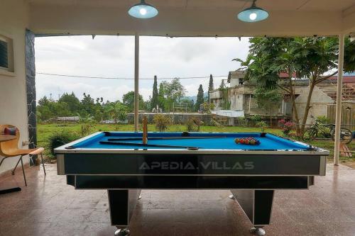 a pool table in the middle of a house at Villa DBusso Apedia, 3 BR, SP, Billiard, Karaoke in Kopo 2