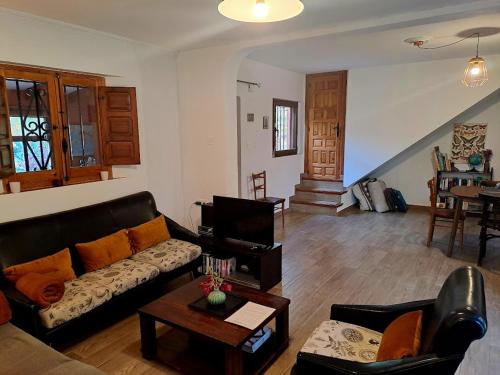 a living room with a couch and a table at Casa Champasak in Órgiva