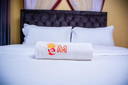 a towel with a crown on top of a bed at Emarah Getaway Sagana in Sagana