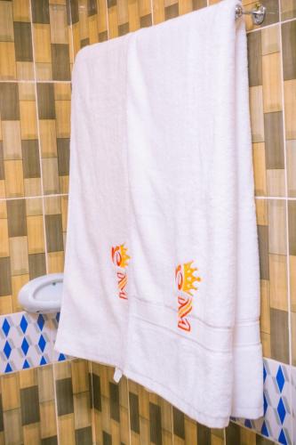 a towel hanging on a towel rack in a bathroom at Emarah Getaway Sagana in Sagana
