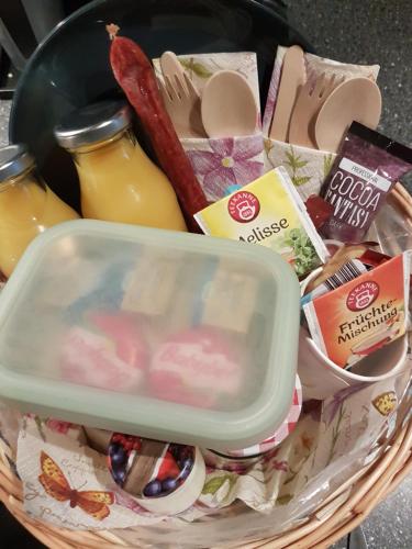 a basket filled with food and condiments at TrekkingCamp Himmelsterrassen in Bad Peterstal-Griesbach