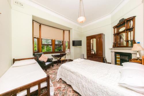 Ένα ή περισσότερα κρεβάτια σε δωμάτιο στο East Sydney Hotel