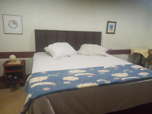 En eller flere senge i et værelse på Pousada Capão do Índio
