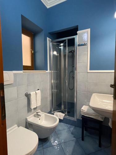 a bathroom with a toilet and a sink and a shower at B&B Lunaponzese-Ponza centro in Ponza