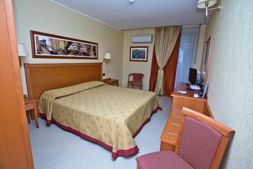 Katil atau katil-katil dalam bilik di Hotel Relais dei Normanni