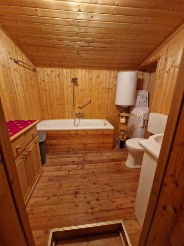 a bathroom with a tub and a toilet and a sink at Wiener Mühle in Malta