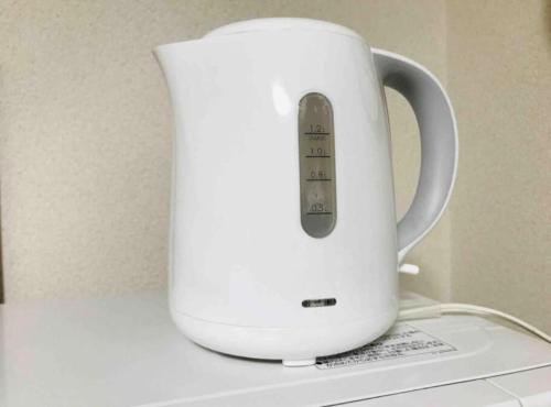 a white blender sitting on top of a counter at ZY House in Osaka