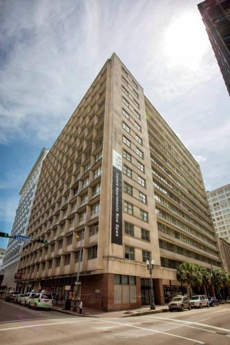 a large building on the corner of a street at Spacious Modern Condos near French Quarter in New Orleans
