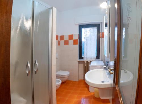 a bathroom with a sink and a toilet and a shower at Da Ernestina in Imperia