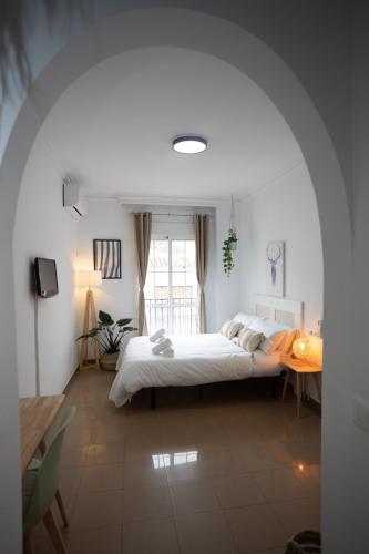 Postel nebo postele na pokoji v ubytování Naim Guest House Nerja