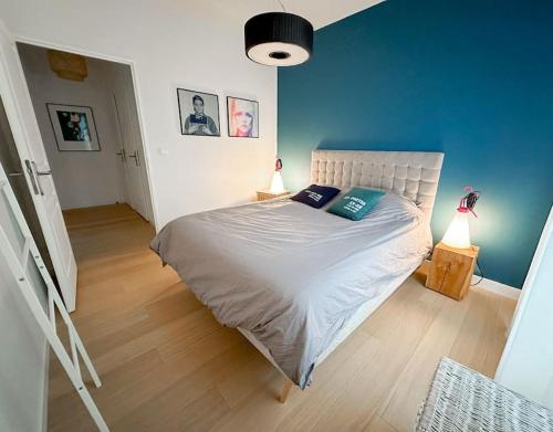 En eller flere senge i et værelse på Le cocon d’Oliver