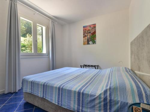 Ένα ή περισσότερα κρεβάτια σε δωμάτιο στο Apartment in Elba near Straccoligno Beach