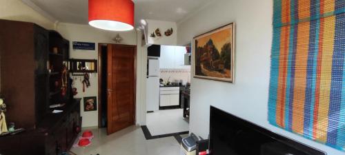 a living room with a hallway and a kitchen at Apartamento bambu Laranjeiras in Rio de Janeiro