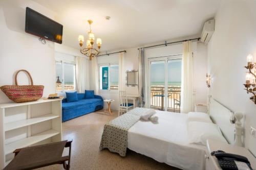 Postel nebo postele na pokoji v ubytování Hotel Tizian Beach