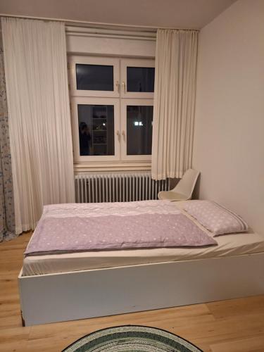 Postel nebo postele na pokoji v ubytování Gartenblick
