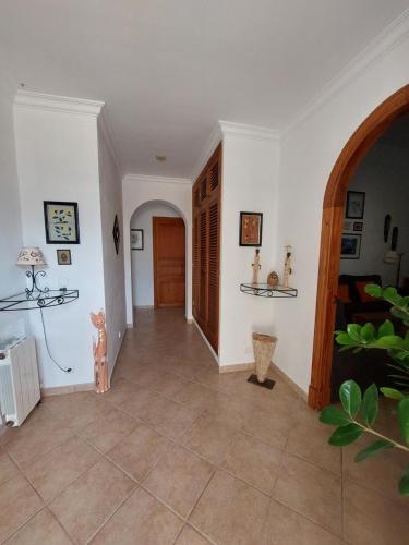 a hallway with white walls and a tile floor at Dau 39 in Montuiri