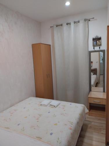 Ένα ή περισσότερα κρεβάτια σε δωμάτιο στο Apartmani Jaz 24