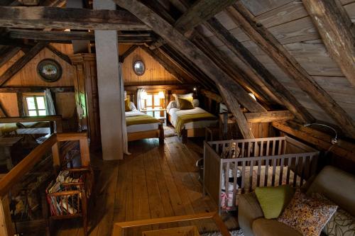 an overhead view of a bedroom in a cabin at La Grange d'Hannah - gîte & chambre d’hôtes de charme in Orbey