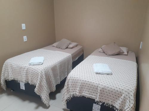 Ein Bett oder Betten in einem Zimmer der Unterkunft HOTEL LISBOA