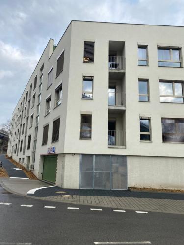 an apartment building on the side of a street at Luxusný apartmán v centre in Banská Bystrica