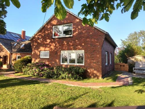 a brick house with two windows on it at Ferienhaus Bonishof in Westerholt