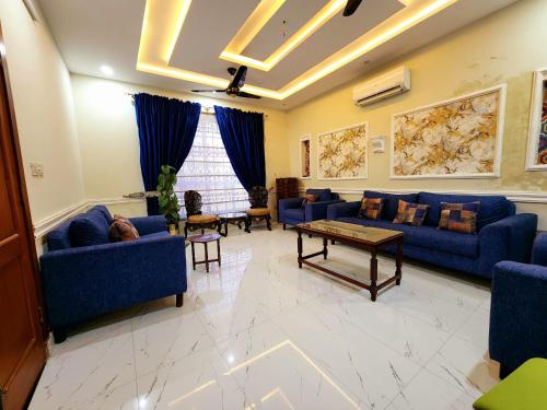 Ruang duduk di Motorway Majesty Lodges - Near Islamabad International Airport & Motorway