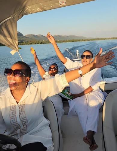 a group of people on a boat on the water at Le Bamboo Guest House And Boat Cruise in Hartbeespoort
