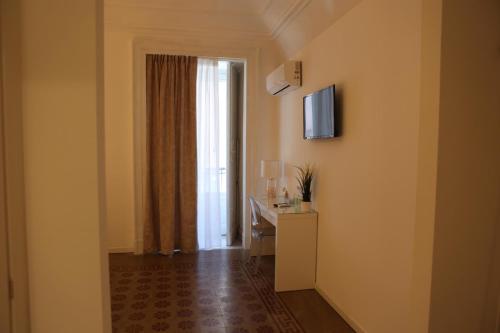 a hotel room with a hallway with a window at Boutique Rooms B&B in Catania