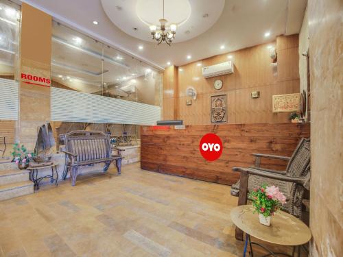 a waiting room with benches and a stop sign on the wall at OYO Hotel Yellow Stone in Patiāla