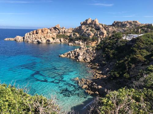 a view of a rocky island in the ocean at Alba Majore beach apartment in Rena Majore