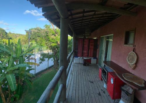 an outside porch of a house with a balcony at Vários Apartamentos no villas maceio in Maceió