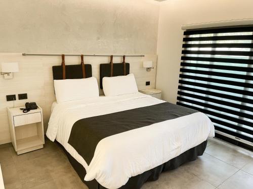 Postel nebo postele na pokoji v ubytování Mar Azul Suites Apart Boutique