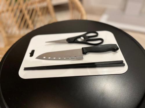 a pair of scissors sitting on top of a table at AQA ART 江の島 in Fujisawa