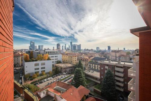 a view of a city with buildings and cars at HACCA Collection - Isola 1BR in Milan