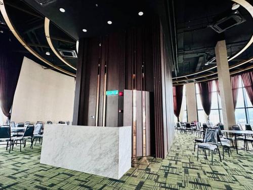 a room with chairs and a table in a building at New Urban Suite Majestics 3BR Homestay at Georgetown BY URBAN STAYCATION HENG LOD in Jelutong