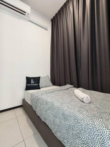a bedroom with a bed with a black curtain at New Urban Suite Majestics 3BR Homestay at Georgetown BY URBAN STAYCATION HENG LOD in Jelutong